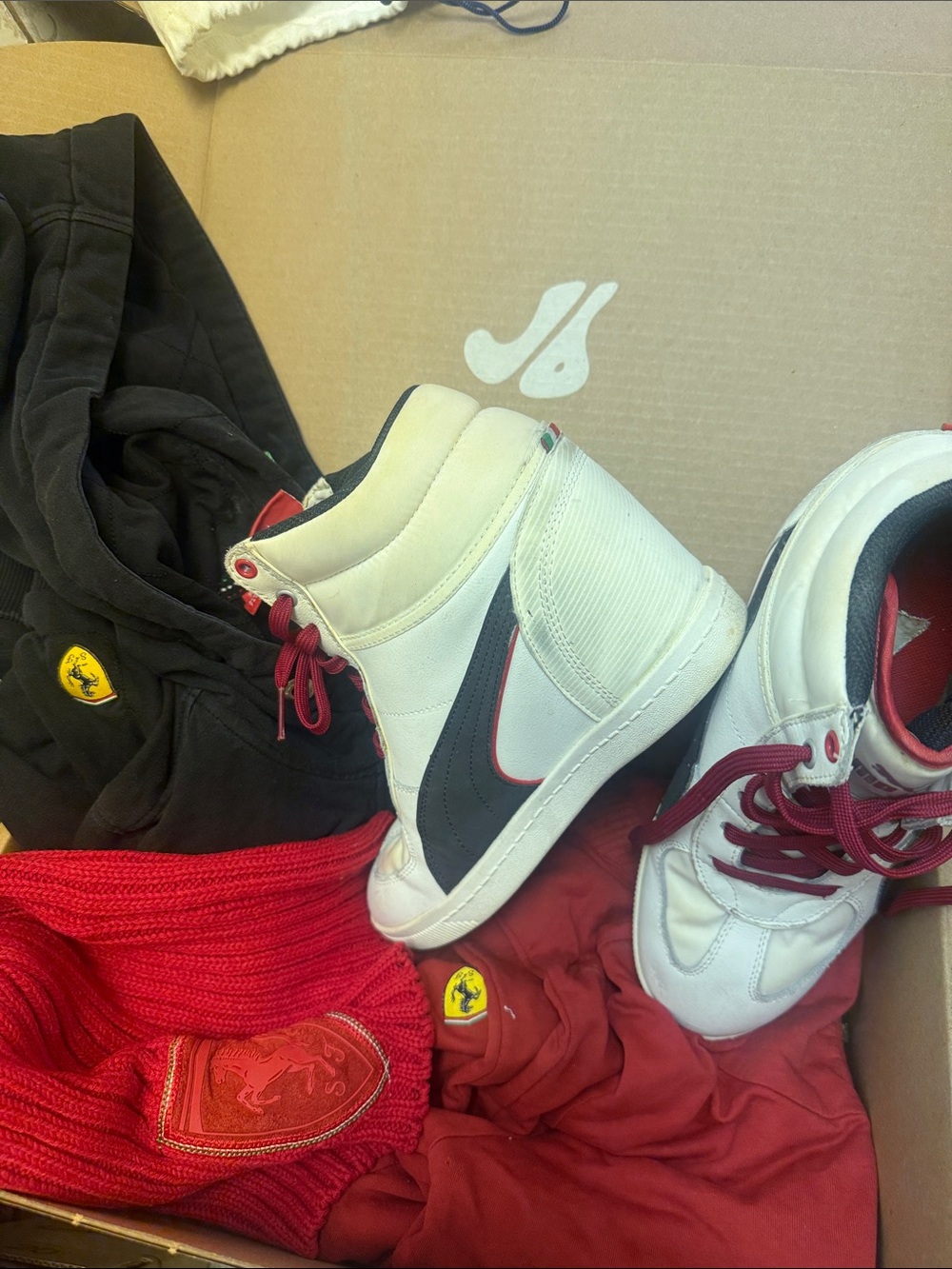 Ferrari White High-Top Sneakers with Black Swoosh and Red Accents